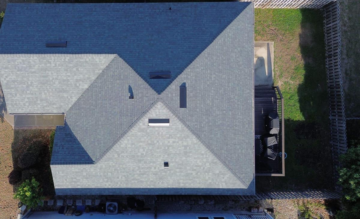 Overhead drone view of the Alachua roof with hip and valley lines crossing near the center