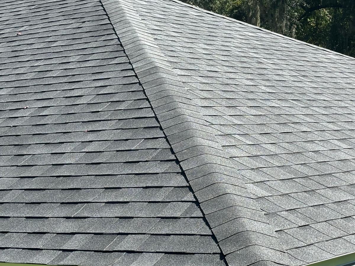 Close view of cap shingles folded over a hip on the new Gainesville roof