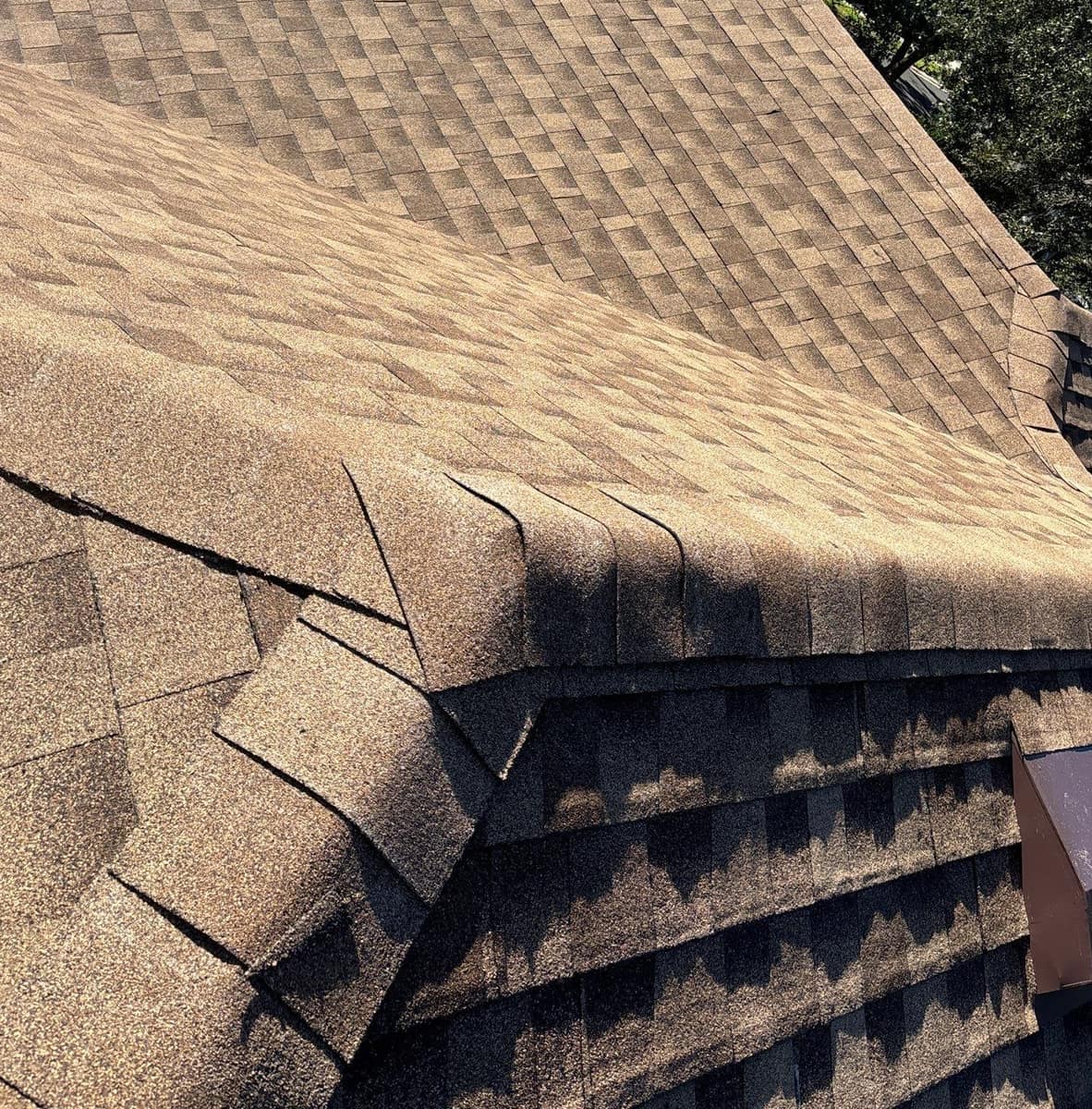 Close view of the capped hip and ridge lines where two roof sections meet in Gainesville