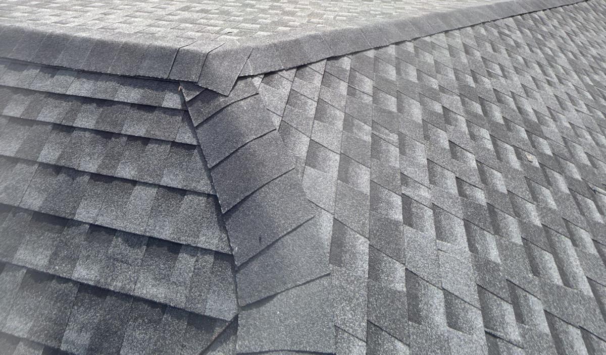 Close view of cap shingles where a hip runs up to meet the ridge in Gainesville