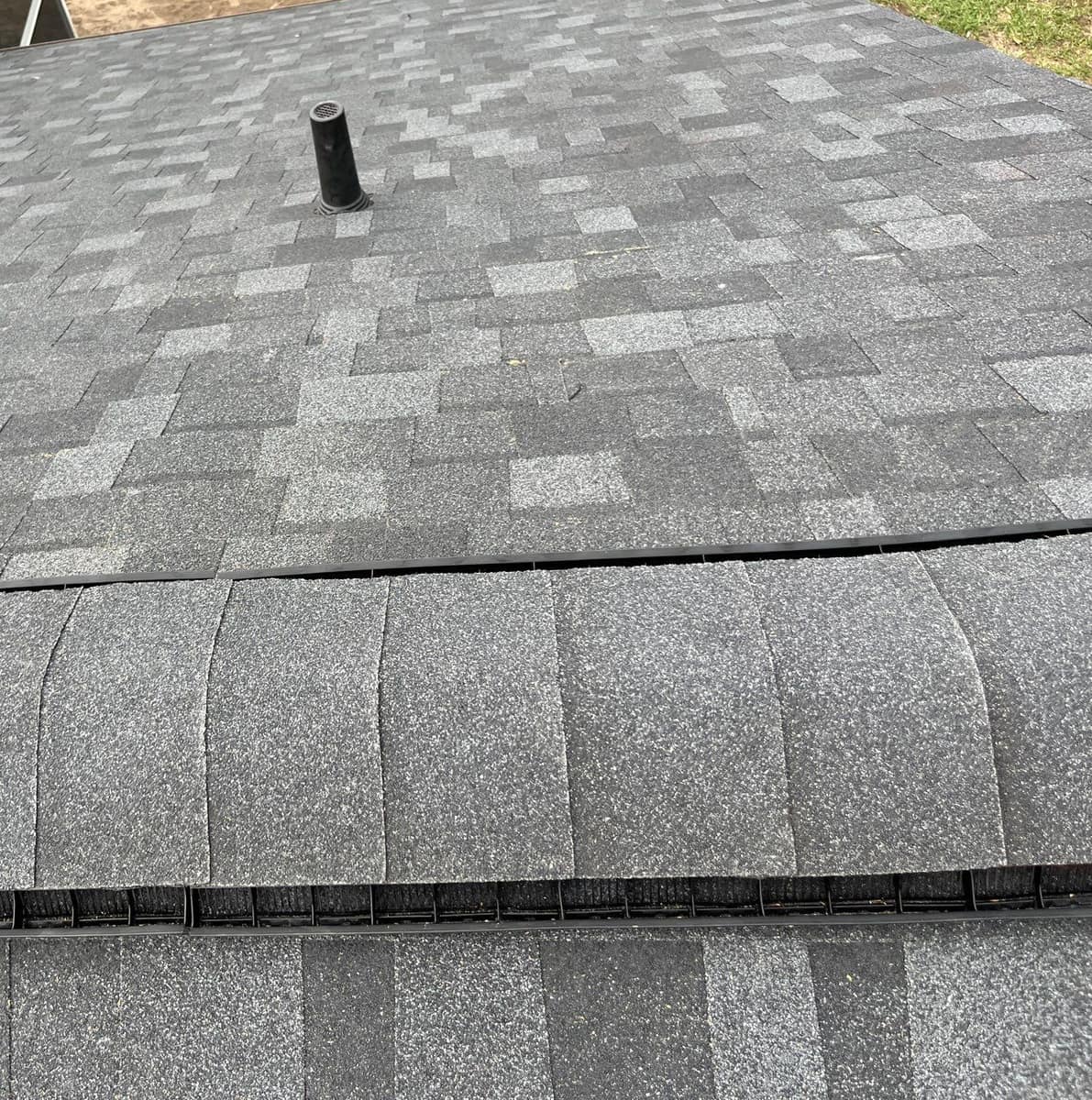 Close view of ridge cap shingles over the ridge vent on the Gainesville roof
