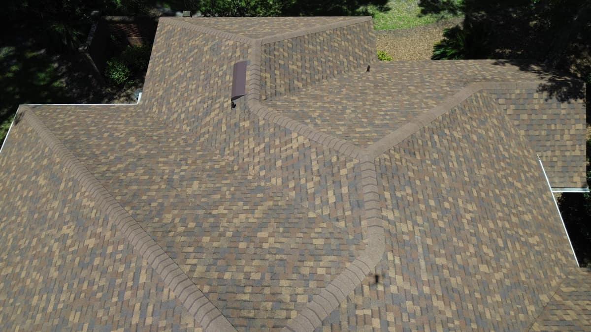 Overhead view of hip caps meeting on the back corner of the Gainesville roof