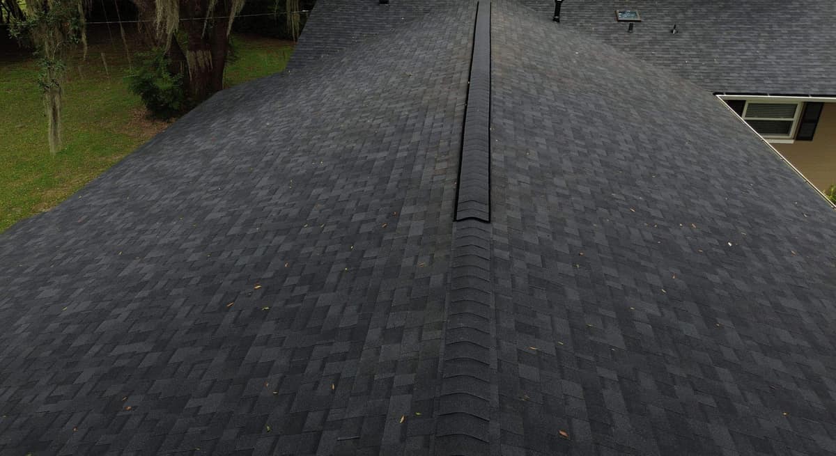 Looking along the main ridge vent toward the skylight and vent pipes in Gainesville
