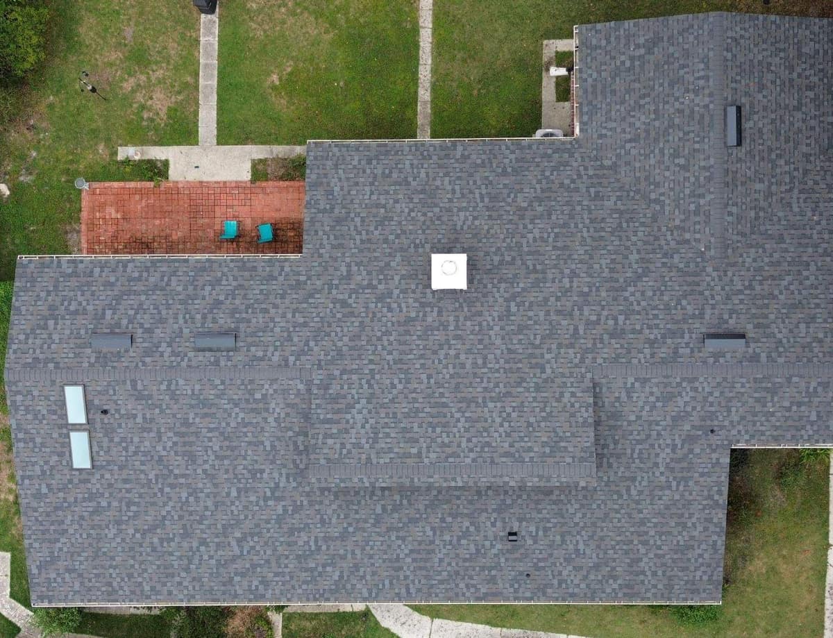 Overhead view straight down on the finished Gainesville roof, chimney chase and brick patio