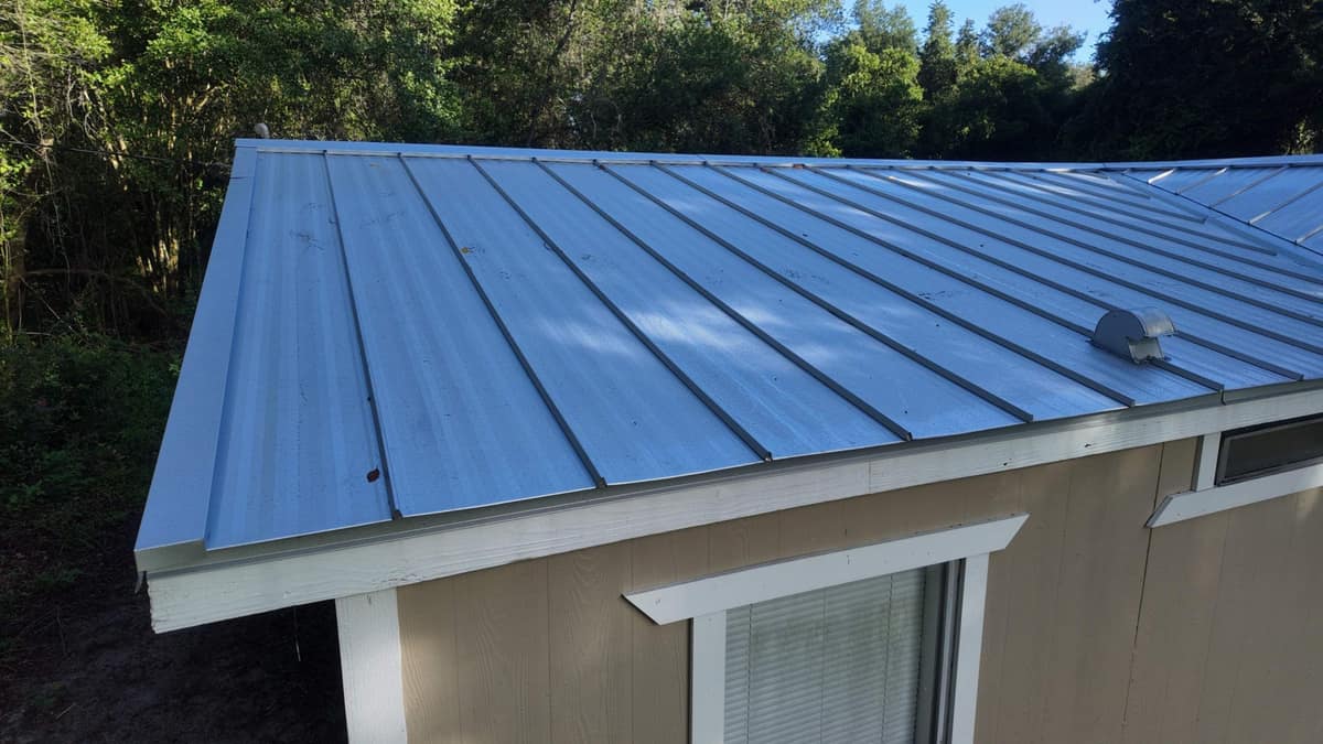 Close drone view of the eave trim, the rake edge and a hood vent in Hampton