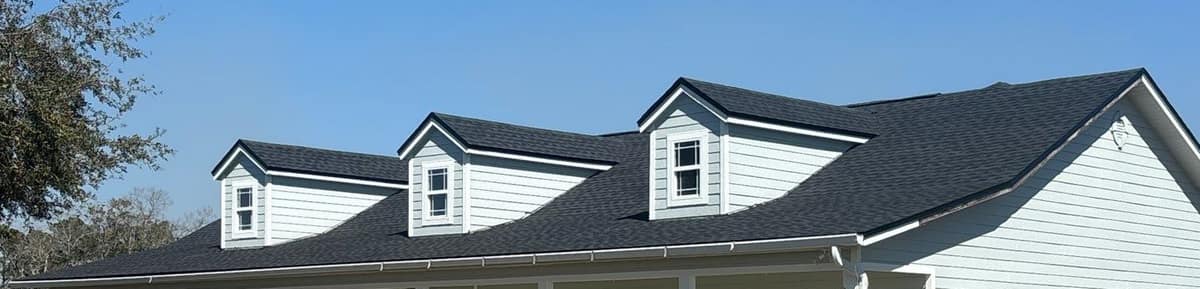 Three gable dormers across the new dark gray front roof of the High Springs home