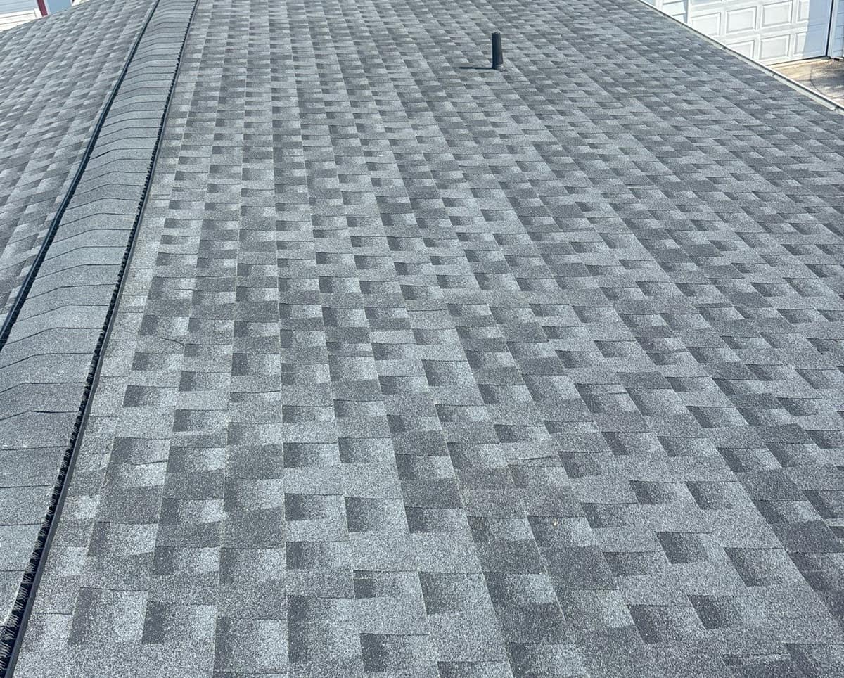 New gray architectural shingles and a ridge vent running the length of a Lady Lake home