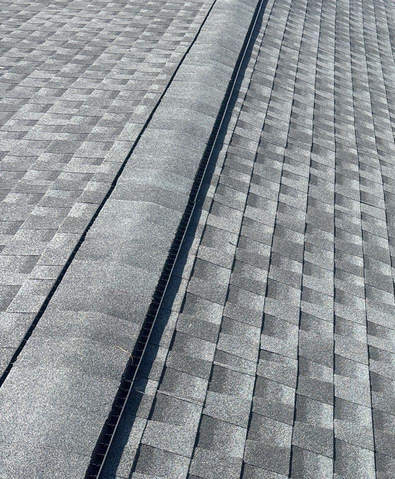 Close view of shingle ridge caps over the ridge vent along the Lady Lake roof