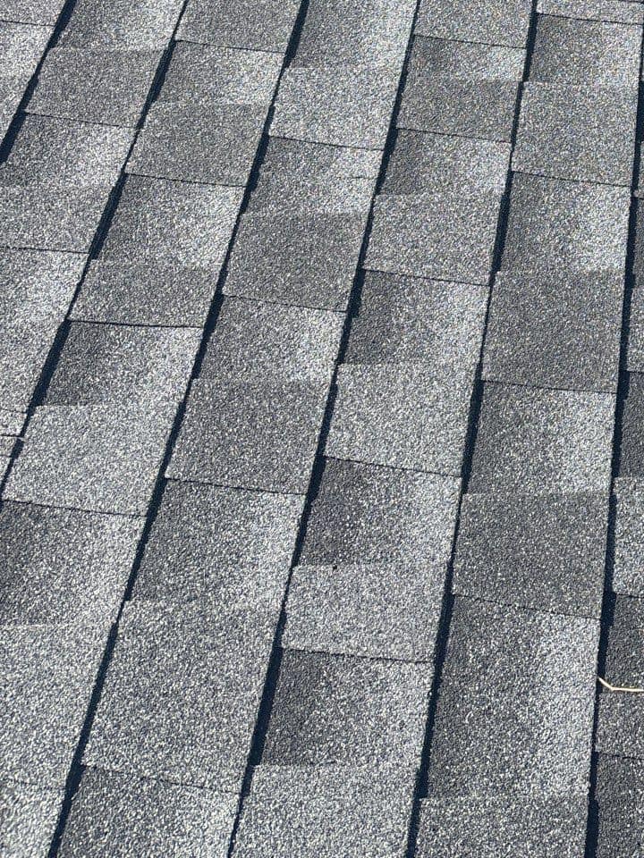 Up close, the charcoal and lighter gray tones of the new shingles in Lady Lake