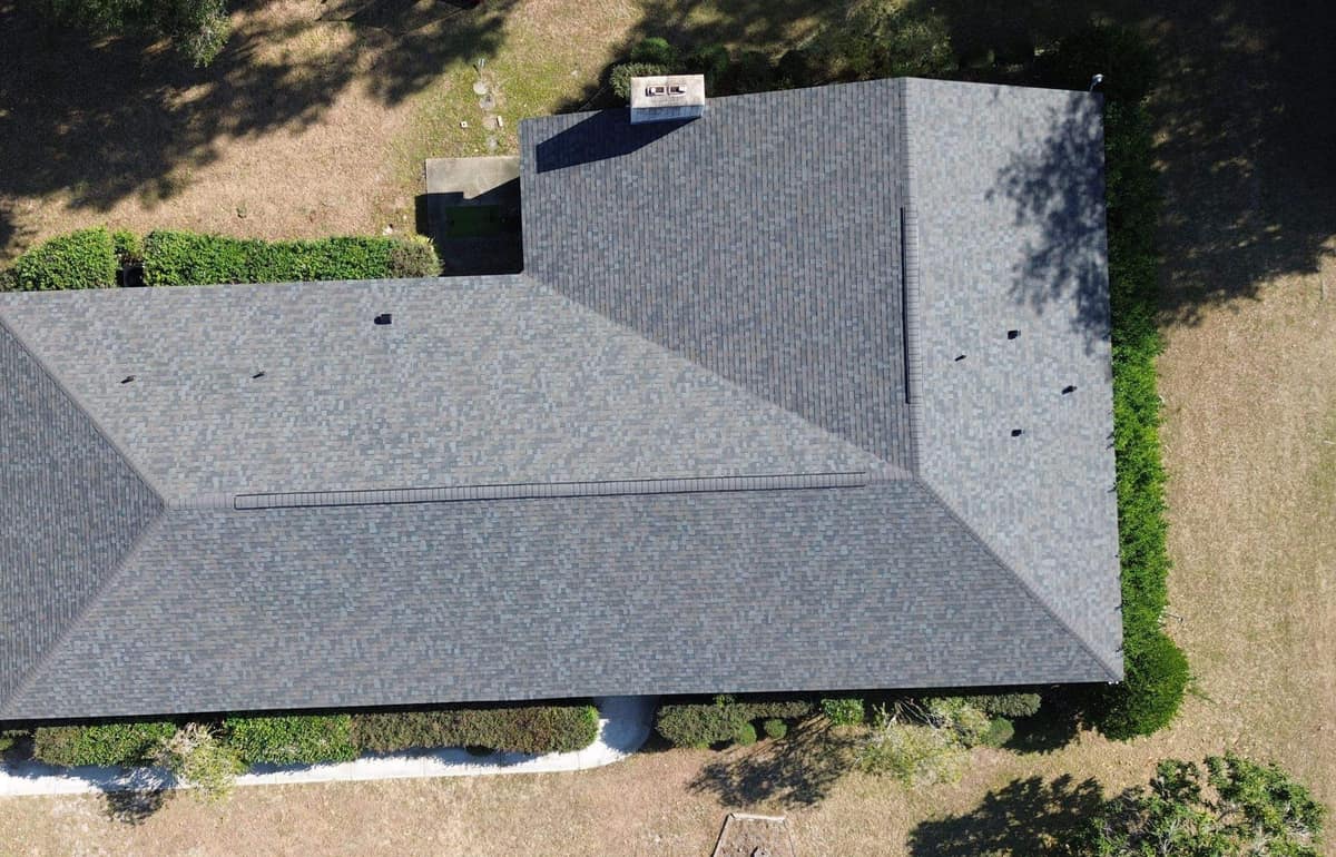 Straight-down drone view of the Lake City hip roof with ridge vents on both ridges