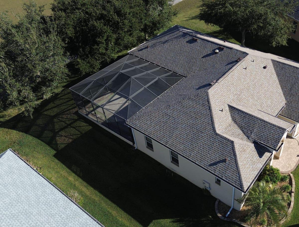 Overhead drone view of the new roof and the screened lanai cage on the Leesburg home