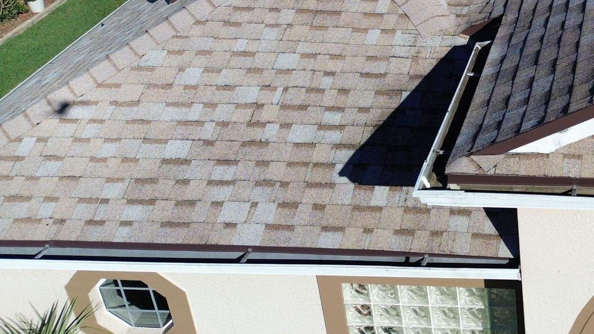 Brown drip edge over a white gutter above an octagon window on the Leesburg home