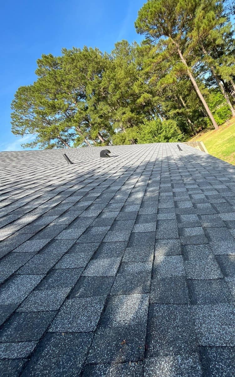 Looking up the rear slope in Newberry at two vent pipes and a hooded exhaust vent