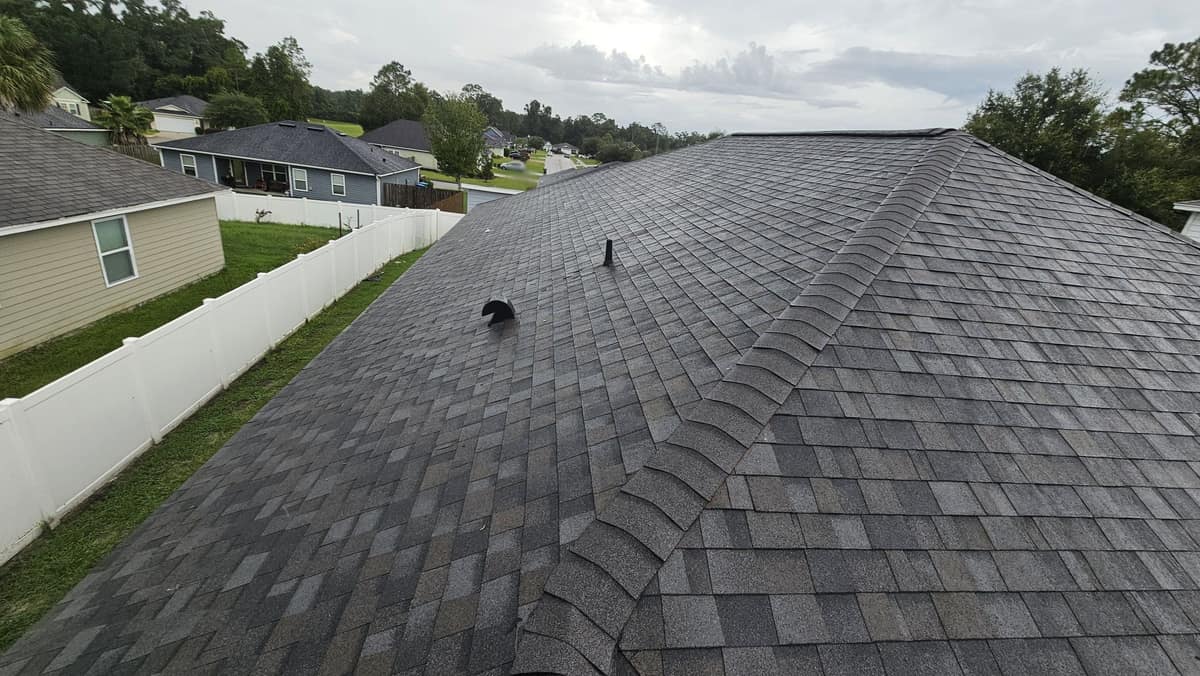 Hip and main slope of the new charcoal blend shingle roof in Newberry, FL