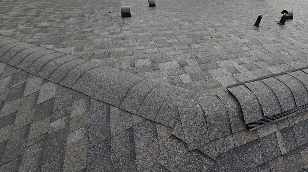 Close view where the hip caps meet the start of the ridge vent in Newberry