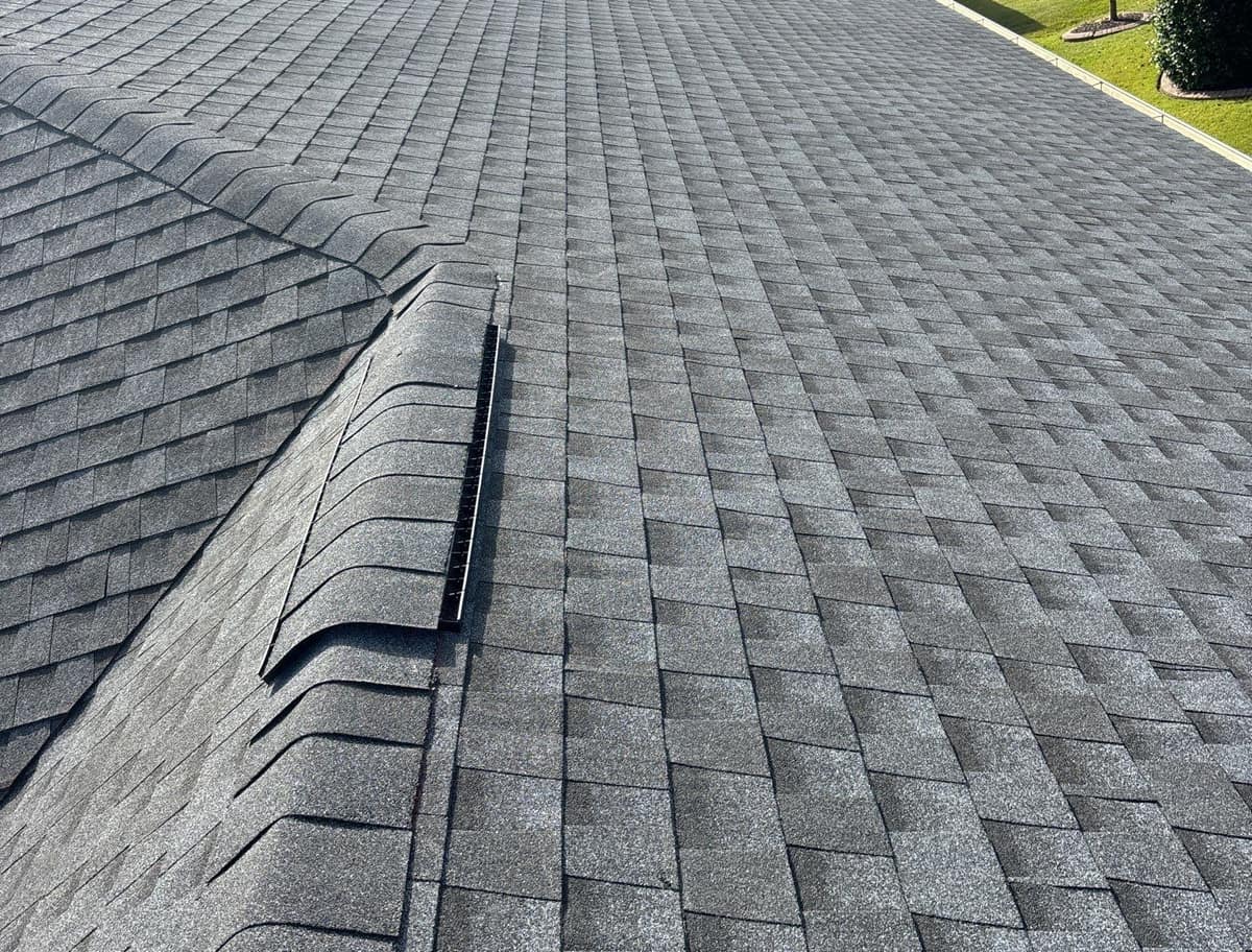 Close view of hip and ridge cap shingles with the ridge vent edge showing in The Villages