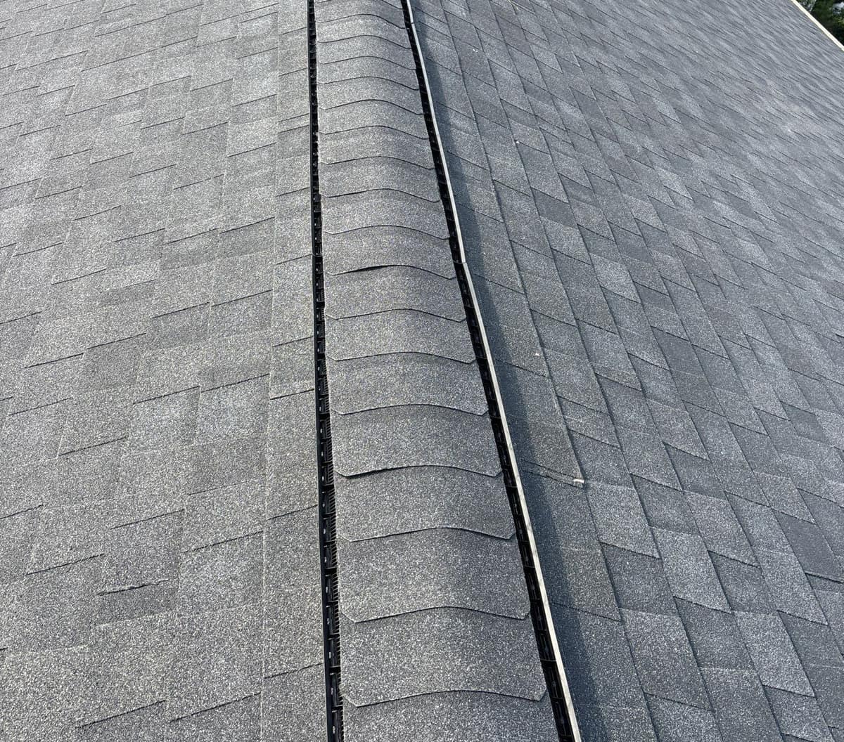 Close view of the ridge vent tucked under cap shingles along the main ridge in The Villages