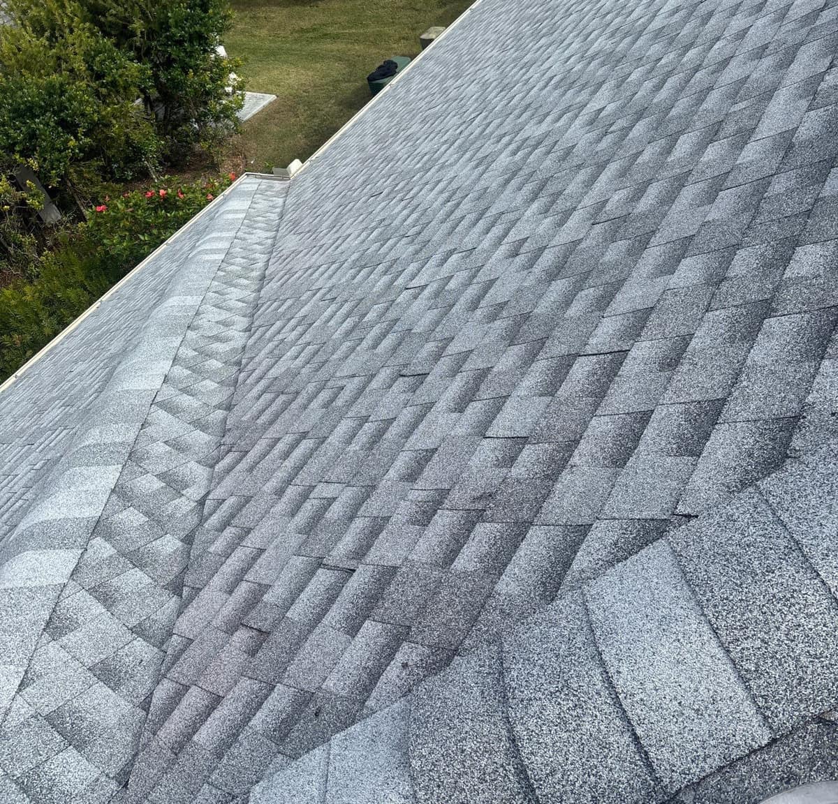 Long run of new light gray shingles sloping down to the gutter on a home in The Villages