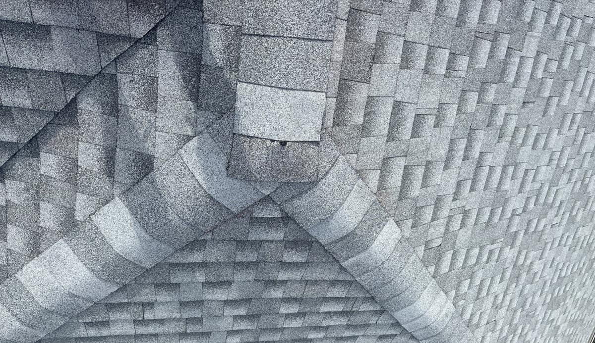 Cap shingles where a ridge meets two hips on the new roof in The Villages
