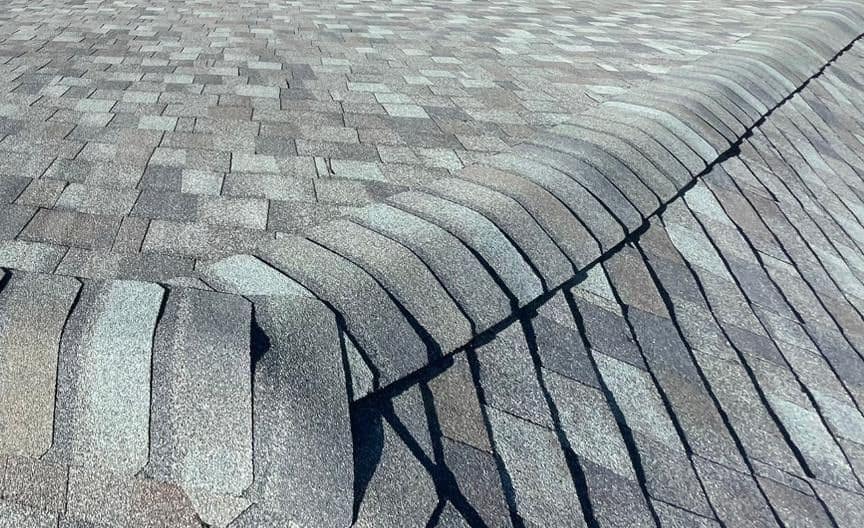 Cap shingles where the ridge meets a hip on the new roof in The Villages