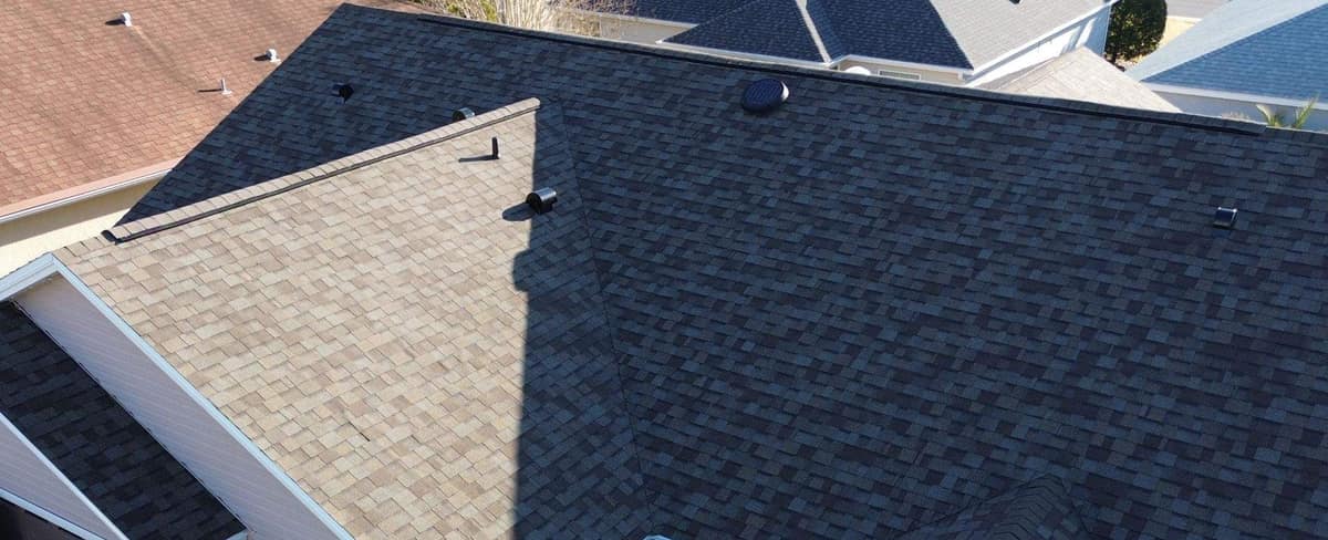 Street side of the home in The Villages, where the garage wing roof meets the main roof